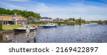 Panorama of houses and boats at the Zuidlaardermeer lake in Groningen, Netherlands