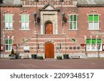 Small photo of PURMEREND, NETHERLANDS - MARCH 31, 2021: Front facade and stairs of the historic town hall in Purmerend, Nether;ands