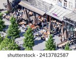 Small photo of DEN BOSCH, THE NETHERLANDS - JUNE 3, 2023: View on cafes and terrasses in the inner city of Den Bosch, or 's-Hertogenbosch, as seen from St. Jan's cathedral.