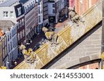 Small photo of DEN BOSCH, THE NETHERLANDS - JUNE 3, 2023: Decorative figurines on a butress of St. Jan's cathedral in the dutch city of Den Bosch.