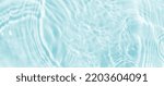 Small photo of Water panoramic banner background. Water texture, water surface with rings and ripple. Spa concept background. Flat lay, top view, copy space, composition with copy-space.