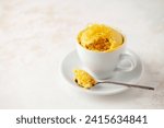 Lemon cupcake in a white mug....