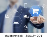 Businessman touching e-commerce button on a virtual interface with icons of shopping cart, delivery, credit card and wireless web, concept about online purchase on internet
