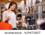 Smiling attractive young women shopping at shoes store