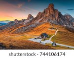 Fantastic sunset landscape, alpine pass and high mountains, Passo Giau with famous Ra Gusela, Nuvolau peaks in background, Dolomites, Italy, Europe