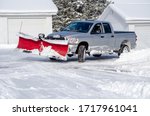 Silver Truck Moving Snow On A...