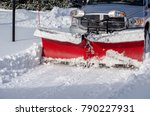 A Truck With A Snow Blade...