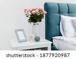 White Bedside Table Near The...