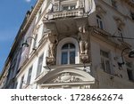 Small photo of Sarajevo, Bosnia and Herzegovina - July 11, 2019: Two atlantes supporting a balcony above the entrance to the pharmacy on the corner of Ferhadija street and Fra Grge Martica square.