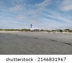 Small photo of The lighthouse on Sullivan's Island seen from the beach