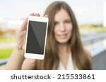 woman holding smartphone in hand