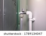 Flexible water supply hoses connect with faucet and pvc pipe.