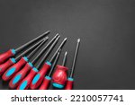 Set of crosshead and hex screwdrivers on black background