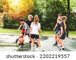 Small photo of A great child Team in sportswear playing basketball game