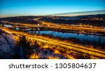 View of Barrandov Bridge over Vltava River in Branik, Prague, Czech Republic. Illuminated roads in cold winter evening.