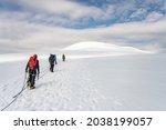 group of mountaineers on a rope.... | Shutterstock . vector #2038199057