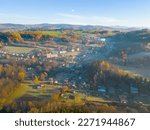 The village of Haratice situated in a sunny autumn hilly landscape, Czech Republic. Aerial view from a drone.