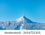Jested Mountain with unique hotel and TV transmitter on the top on sunny winter day, Liberec, Czechia