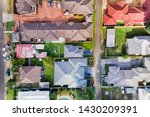 Roof tops and yards of residential homes in Cessnock town of Hunter Valley region of Australia. QUiet lifestyle and comfortable living between green lawns.