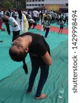 Small photo of Allahabad: People performing Yoga on the occasion of 5th International Yoga Day celebration at Madan Mohan malviya Stadium in Allahabad on May 21, 2019.