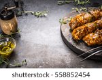 Meat skewers preparation with seasoning  on  dark rustic background, place for text