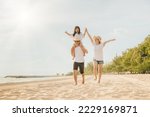 Small photo of Family day. Happy family people having fun in summer vacation run on beach, daughter riding on father back and mother running at sand beach, family trip playing together outdoor, traveling in holiday
