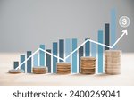 Small photo of Stack of silver coins aligns with an ascending trading chart arrow, epitomizing financial concepts and investment in business stock growth. Technology leaps further this narrative. money saving graph