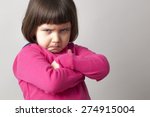 unhappy boyish 4-year old girl expressing disagreement with body language