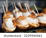Snacks with cod fish in tapas bar in Spain, traditional Spanish food