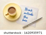 Small photo of Think outside the box concept - hadwiting on a napkin with a cup of coffee, brainstorming, innovative, unorthodox thinking