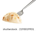 Dumpling with fried onions impaled on a fork  isolated on white background. With clipping path.
