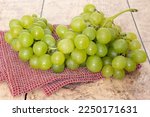 bunch of white grapes on a table