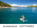 Two people snorkel off the island of Hon Mun near Nha Trang in Vietnam
