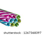 Small photo of Colourly striped plastic drinking straws, white underground background