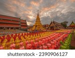 Small photo of Hundred thousand lantern festival in Lamphun is part of the Loi Krathong Festival or Yi Peng Festival To be offered as a Buddhist worship of Phra That Hariphun in lamphun, Thailand.