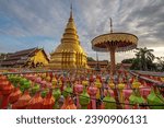 Small photo of Hundred thousand lantern festival in Lamphun is part of the Loi Krathong Festival or Yi Peng Festival To be offered as a Buddhist worship of Phra That Hariphun in lamphun, Thailand.