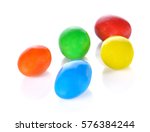 multi colored chocolate ball on white background