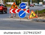 Road signs!Road works with trucks and traffic signs.road works road blocked signs and traffic cones diversion access only;Barriers and road signs.