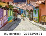 Small photo of colorful street of guatape colonial town, colombia