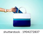 Blue Handbag. Taking Out The...