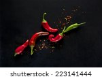 Chili Peppers On A Black...