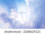 Small photo of Jesus Christ In The Clouds Of Heaven blue sky background,good friday concept