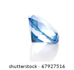 A large fake blue diamond is isolated against a white background with a reflection.