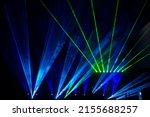 Small photo of Laser show beams. Many colorful rgb lazer light beams at a concert or a rave party show. Night club flyer design background