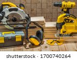 construction carpentry electric hand tools on wooden background
