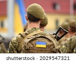 Ukrainian soldier. Ukrainian in army. Ukrainian flag on military uniform. Troops of Ukraine.