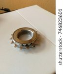 Small photo of Freewheel/Sprocket for bicycle on white board paper