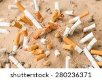 Cigarettes Butt In Sand Ashtray 