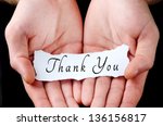 Man holding thank you word in palm