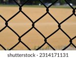 A view of a baseball diamond behind the fench